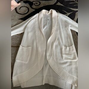 Long cream cardigan sweater.